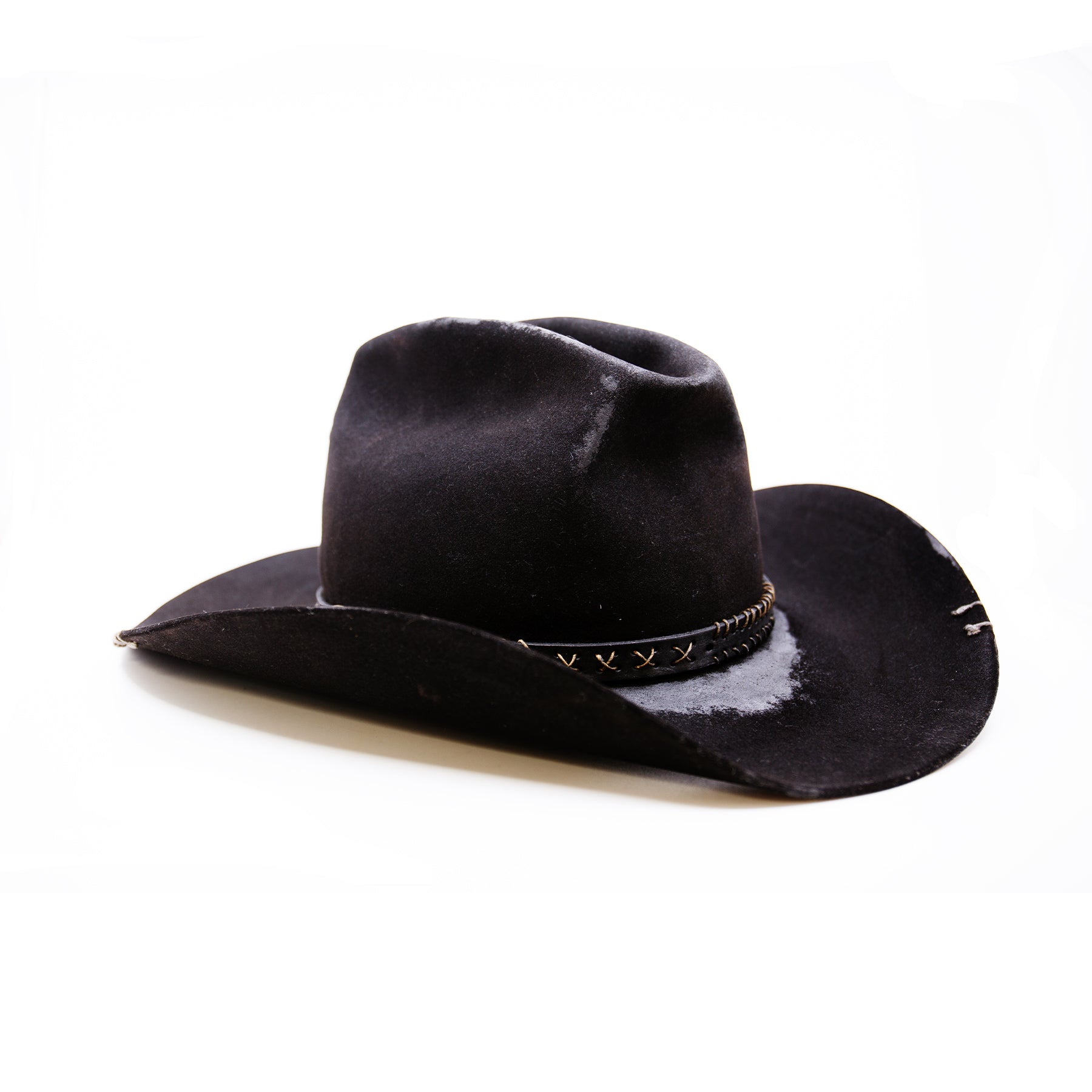 Stokksnes  100% felt hat in Black   Western Weight  ½” Black leather band with Japanese paper string ornaments    Cattleman crease with donkey kick   Western flanged brim  Made in USA