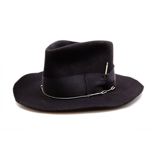 Dyrholaey  100% felt hat in Black   Dress weight  2” tonal grosgrain band & bow  NF alternating silver chain on base  Organic uncut brim   Made in USA 