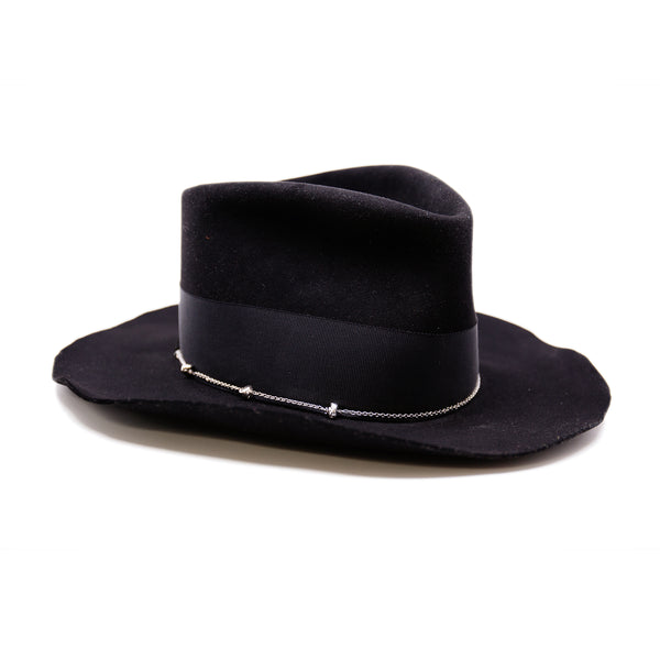 Dyrholaey  100% felt hat in Black   Dress weight  2” tonal grosgrain band & bow  NF alternating silver chain on base  Organic uncut brim   Made in USA 