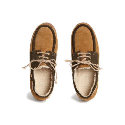 Shearling Boat Shoe - Brown Trim Fur lambskin boat shoes featuring dark brown trim Gold-tone eyelets Rope shoe laces with gold-tone embellishments Shearling lining Rubber sole Country of origin: Italy