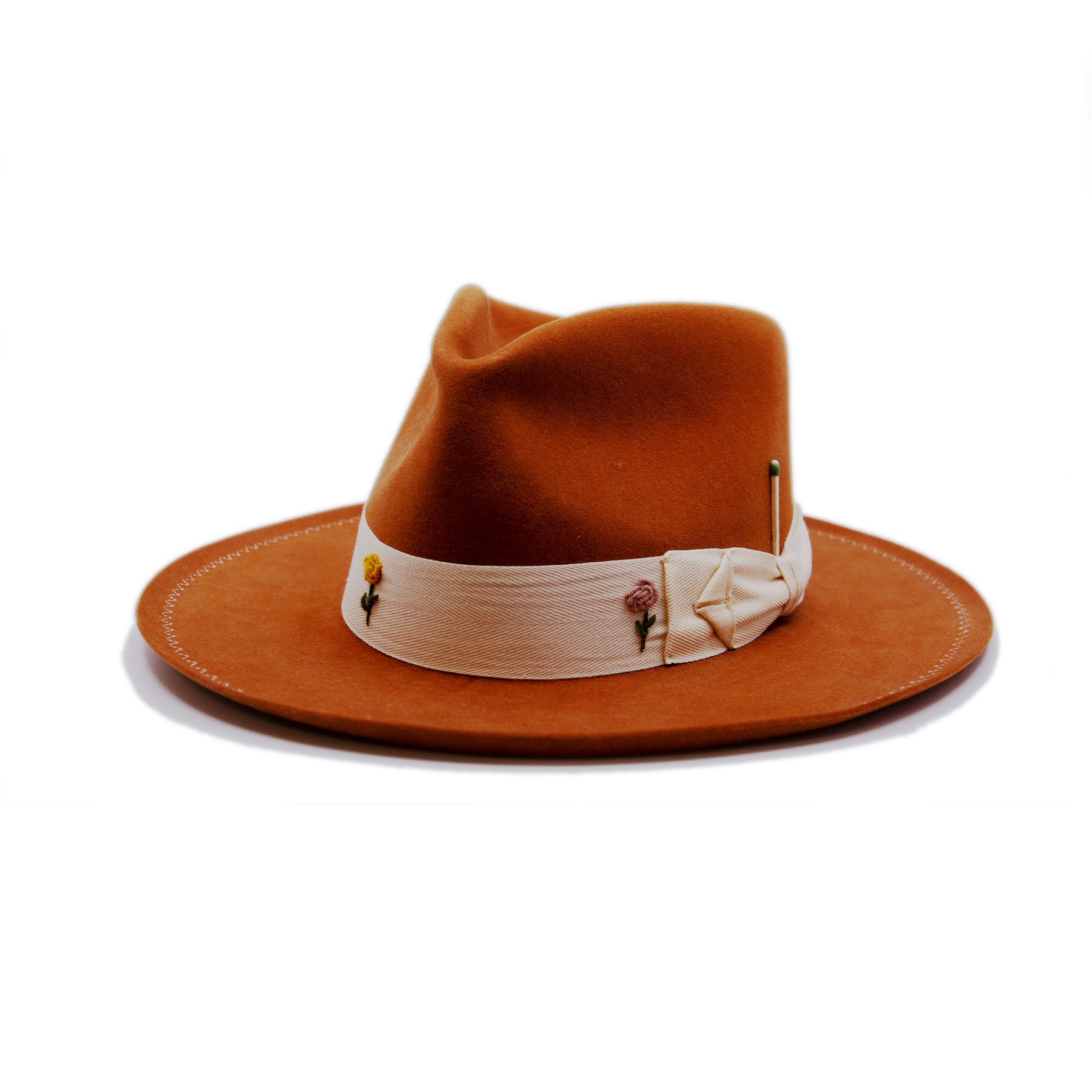 Fleure de Mal  100% felt hat in Kaia  Western Weight  1 1/2" cream herringbone band with spider bow   Multi color hand embroidered flowers on band  Cream zig zag stitching on brim  Slight pencil curled brim  Made in USA