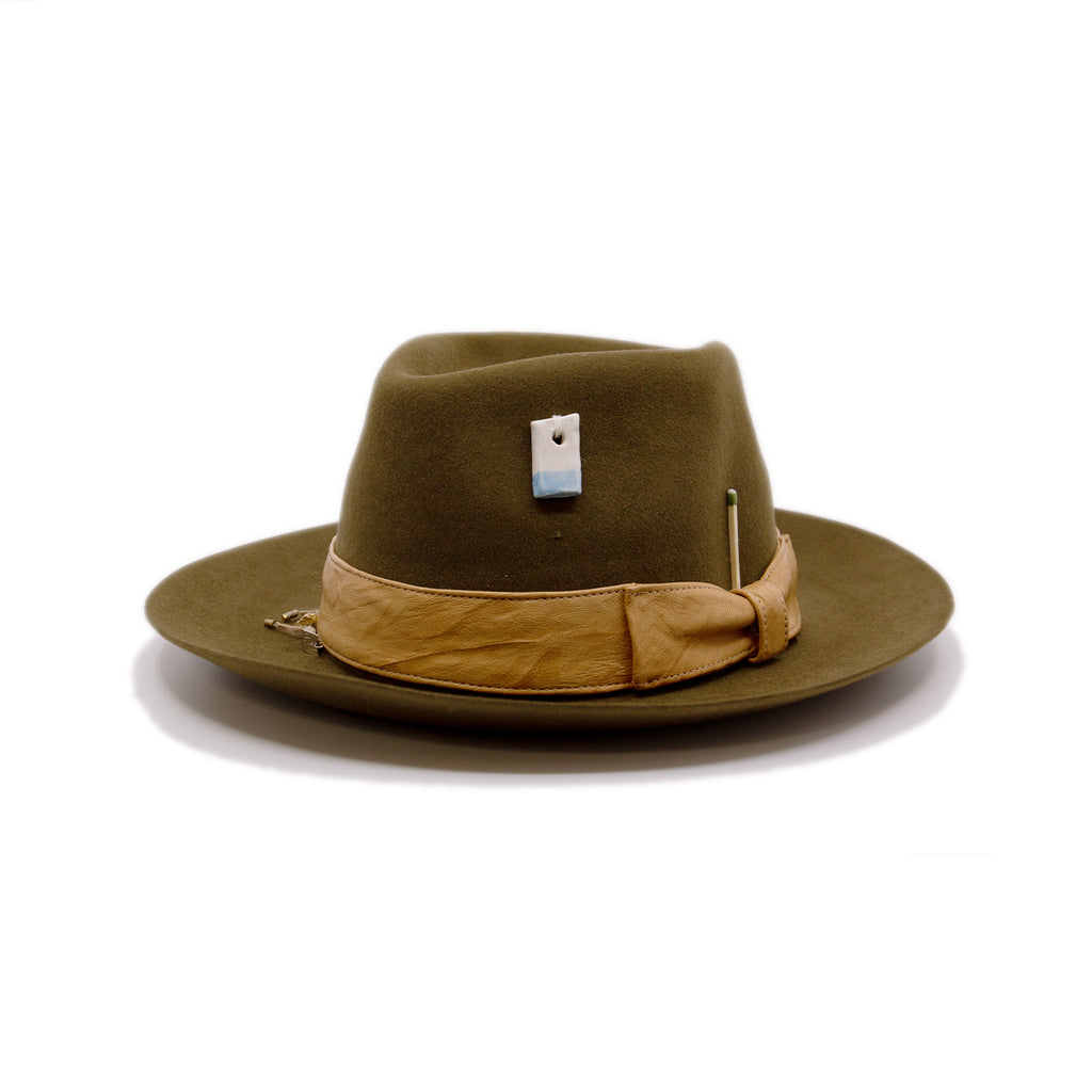 Temple of Mediclaytion Hat  100% felt hat in Olive Oil  Dress Weight  1 1/2" borello leather band and bow in natural  Rectangular handmade ceramic on crown   NF Italian chain on base  Flanged brim  Made in USA