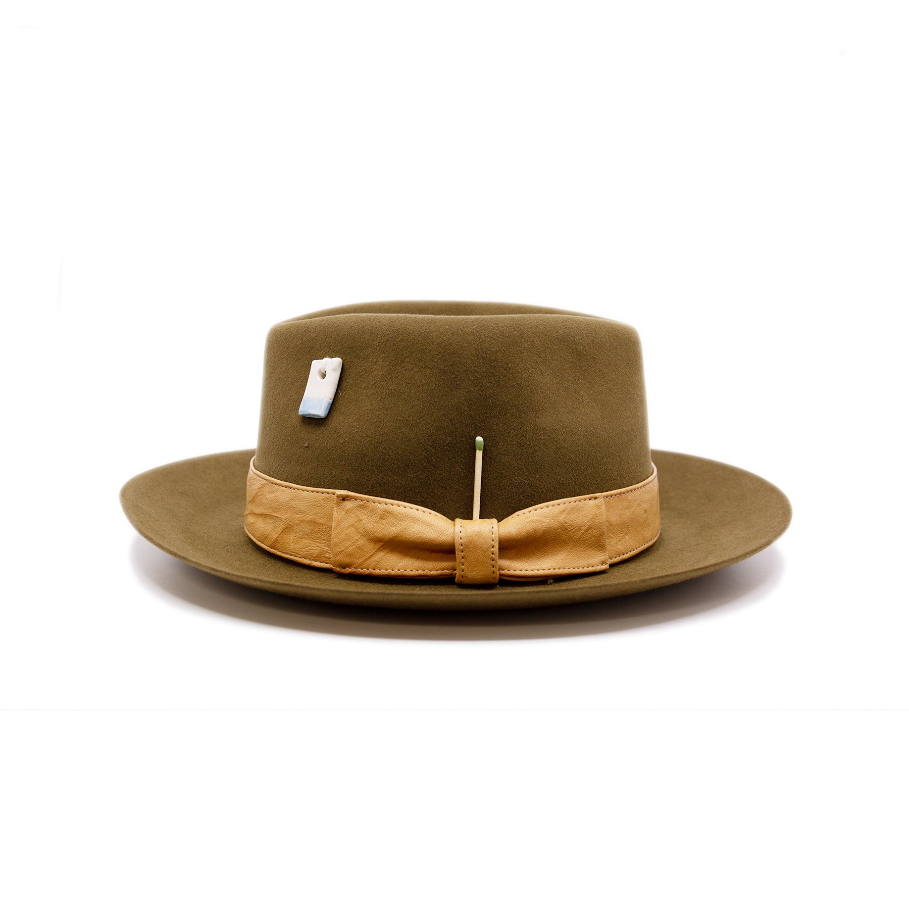 Temple of Mediclaytion Hat  100% felt hat in Olive Oil  Dress Weight  1 1/2" borello leather band and bow in natural  Rectangular handmade ceramic on crown   NF Italian chain on base  Flanged brim  Made in USA