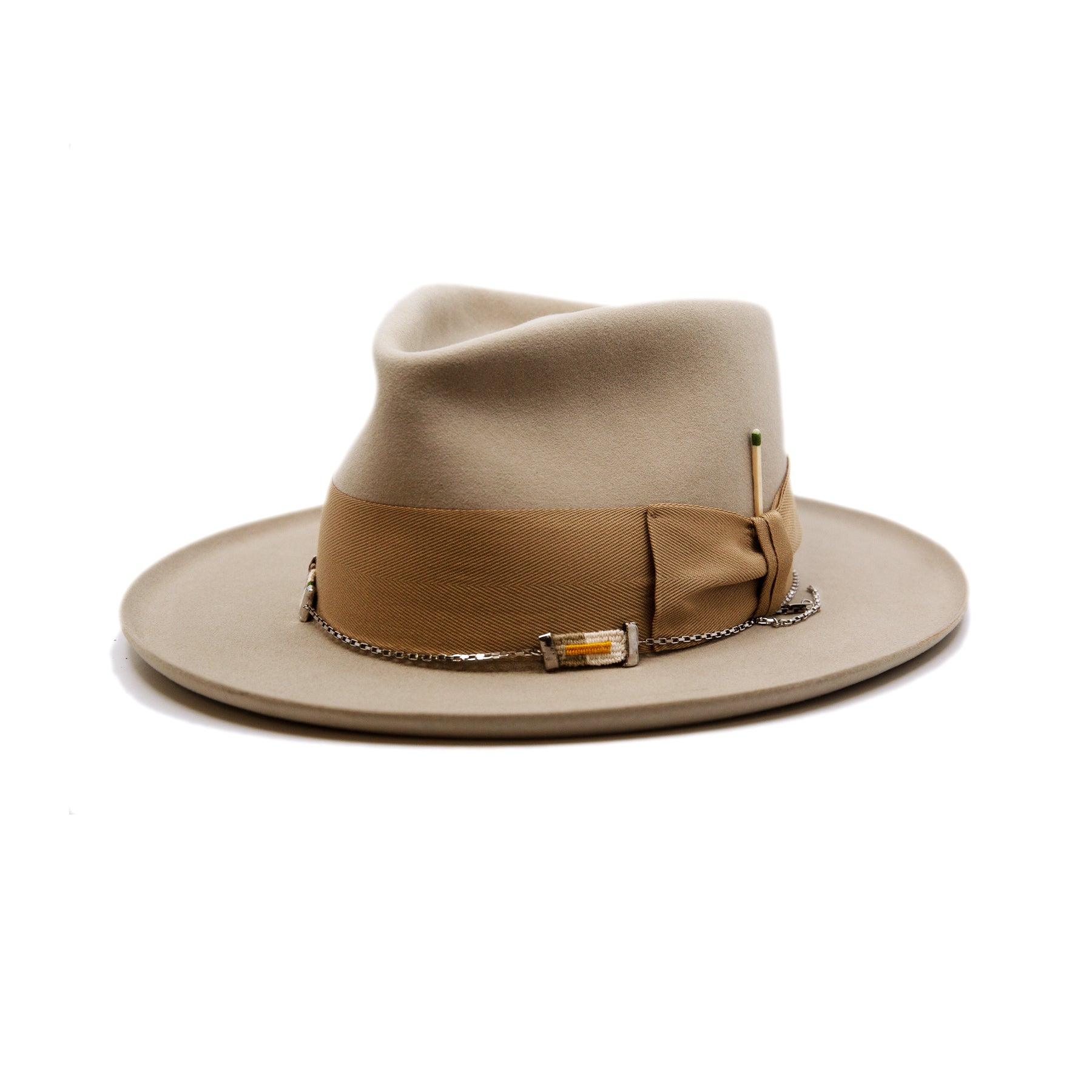 St. Palais  100% felt hat in Sand  Western Weight  2" tonal herringbone band and bow   NF Italian chain on base  Slight pencil curled brim  Made in USA