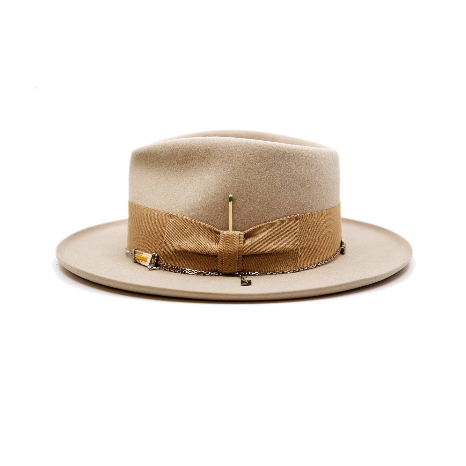 St. Palais  100% felt hat in Sand  Western Weight  2" tonal herringbone band and bow   NF Italian chain on base  Slight pencil curled brim  Made in USA