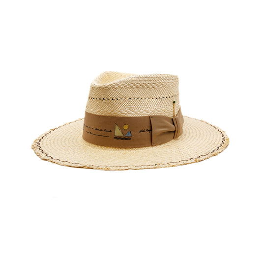 Mehari  100% Ecuadorian straw in Natural  Special NF Weave  2" tan herringbone band and bow   Custom NF iconography in band  Zig zag stitching on brim   Woven in Ecuador  Frayed brim  Made in USA