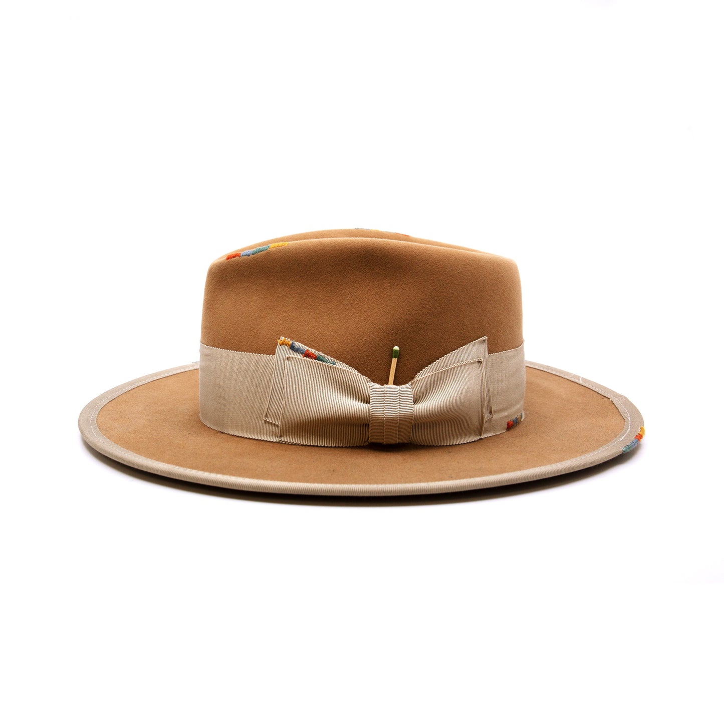 Phare Ouest  100% felt hat in Café Latte  Western Weight  2" tonal grosgrain band and double bow   Multi color handmade whip stitching throughout    Full binding  Flat brim  Made in USA
