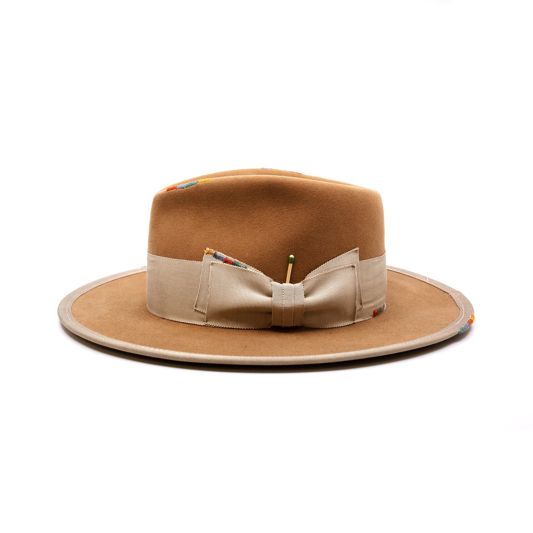 Phare Ouest  100% felt hat in Café Latte  Western Weight  2" tonal grosgrain band and double bow   Multi color handmade whip stitching throughout    Full binding  Flat brim  Made in USA