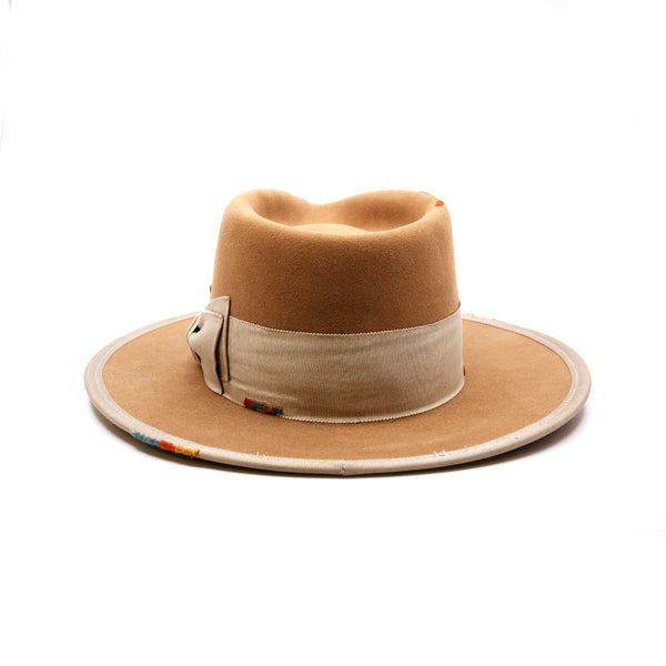 Phare Ouest  100% felt hat in Café Latte  Western Weight  2" tonal grosgrain band and double bow   Multi color handmade whip stitching throughout    Full binding  Flat brim  Made in USA
